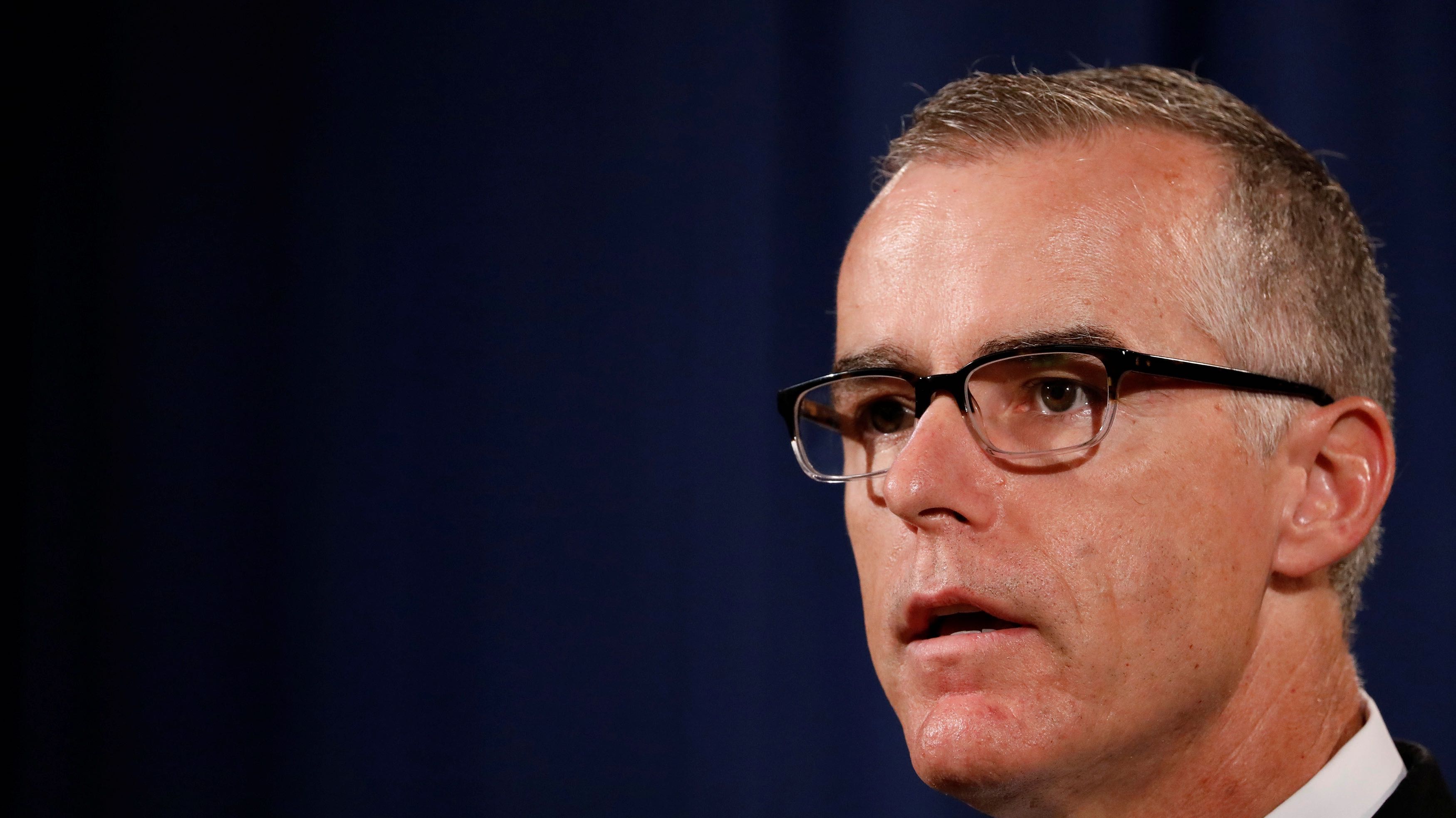 FBI Acting Director Andrew McCabe speaks during a news conference announcing the takedown of the dark web marketplace AlphaBay, at the Justice Department in Washington