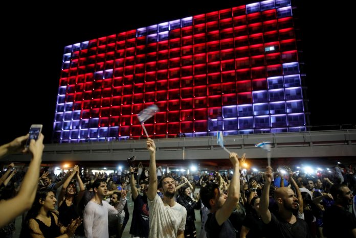 People celebrate the winning of the Eurovision Song Contest 2018 by Israel's Netta Barzilai with her song