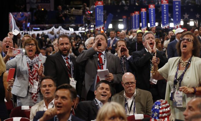 Republican National Convention delegates yell and scream at the Republican National Convention in Cleveland