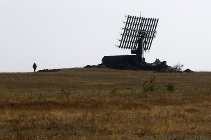 A Russian soldier guards a mobile radar near Kamensk-Shakhtinsky