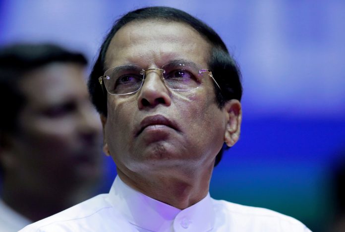 FILE PHOTO: Sri Lanka's President Sirisena looks on during a special party convention in Colombo