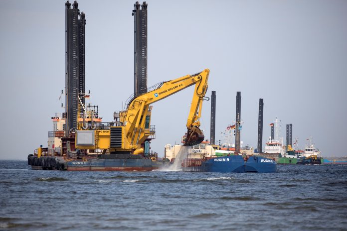 FILE PHOTO: Floating excavators prepare an underwater trench for the North Stream 2 pipeline close to Lubmin